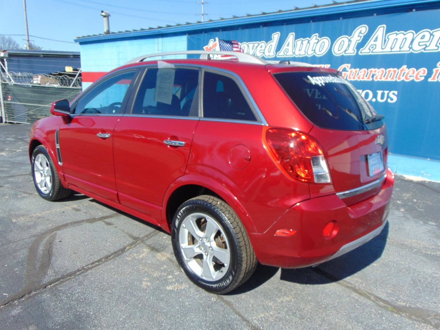 2015 Red Chevrolet Captiva Sport (3GNAL3EK6FS) with an 4-Cyl Flex Fuel 2.4 Liter engine, Automatic, 6-Spd transmission, located at 2105 Dixie Hwy, Louisville, KY, 40210, (502) 772-3333, 38.220932, -85.795441 - Photo#12